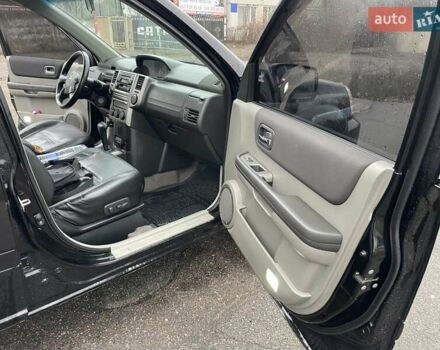 Черный Ниссан ИксТрейл, объемом двигателя 2.5 л и пробегом 285 тыс. км за 6500 $, фото 13 на Automoto.ua