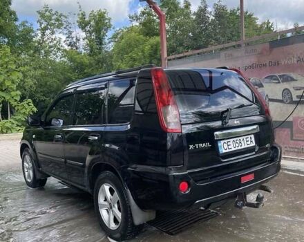 Черный Ниссан ИксТрейл, объемом двигателя 2.2 л и пробегом 300 тыс. км за 7000 $, фото 4 на Automoto.ua