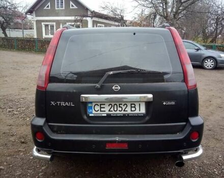 Черный Ниссан ИксТрейл, объемом двигателя 2.5 л и пробегом 202 тыс. км за 6700 $, фото 2 на Automoto.ua