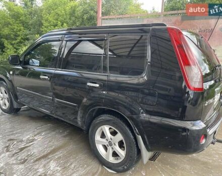 Черный Ниссан ИксТрейл, объемом двигателя 2.2 л и пробегом 300 тыс. км за 7000 $, фото 3 на Automoto.ua