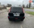 Черный Ниссан ИксТрейл, объемом двигателя 2.5 л и пробегом 285 тыс. км за 6500 $, фото 4 на Automoto.ua