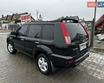 Черный Ниссан ИксТрейл, объемом двигателя 2.5 л и пробегом 282 тыс. км за 6250 $, фото 3 на Automoto.ua