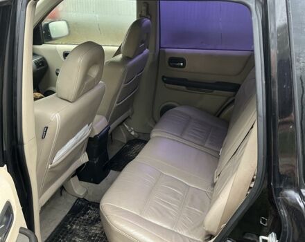 Черный Ниссан ИксТрейл, объемом двигателя 2.2 л и пробегом 327 тыс. км за 3600 $, фото 4 на Automoto.ua