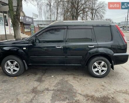 Черный Ниссан ИксТрейл, объемом двигателя 2.5 л и пробегом 285 тыс. км за 6500 $, фото 2 на Automoto.ua