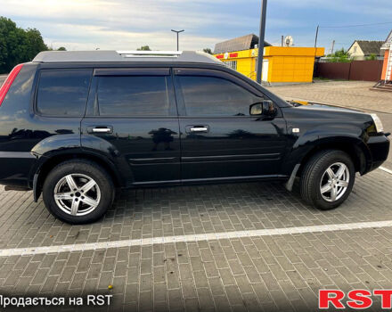 Черный Ниссан ИксТрейл, объемом двигателя 2.5 л и пробегом 280 тыс. км за 7099 $, фото 3 на Automoto.ua