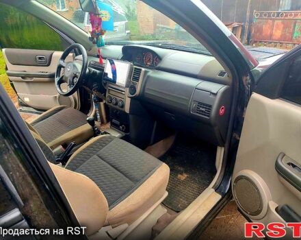 Черный Ниссан ИксТрейл, объемом двигателя 2.2 л и пробегом 248 тыс. км за 3800 $, фото 7 на Automoto.ua