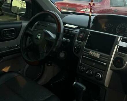 Черный Ниссан ИксТрейл, объемом двигателя 2.5 л и пробегом 261 тыс. км за 8300 $, фото 11 на Automoto.ua