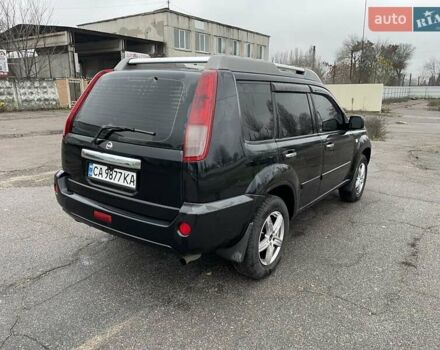 Черный Ниссан ИксТрейл, объемом двигателя 2.5 л и пробегом 285 тыс. км за 6500 $, фото 5 на Automoto.ua