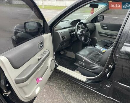 Черный Ниссан ИксТрейл, объемом двигателя 2.5 л и пробегом 285 тыс. км за 6500 $, фото 9 на Automoto.ua