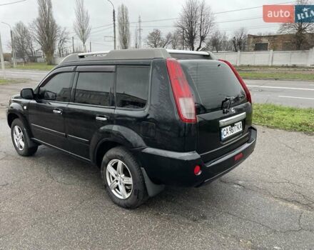 Черный Ниссан ИксТрейл, объемом двигателя 2.5 л и пробегом 285 тыс. км за 6500 $, фото 3 на Automoto.ua