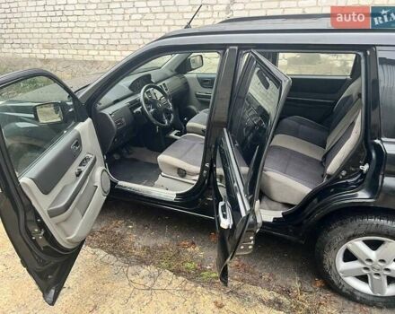 Черный Ниссан ИксТрейл, объемом двигателя 2 л и пробегом 150 тыс. км за 6500 $, фото 6 на Automoto.ua