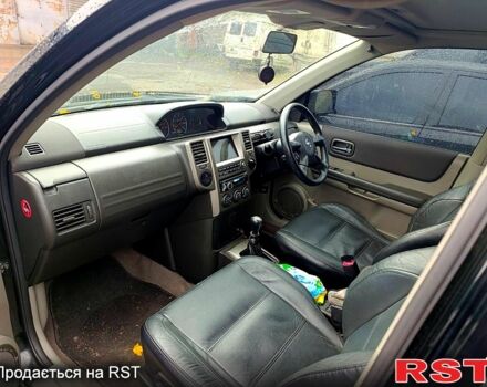 Черный Ниссан ИксТрейл, объемом двигателя 2.2 л и пробегом 180 тыс. км за 4500 $, фото 12 на Automoto.ua