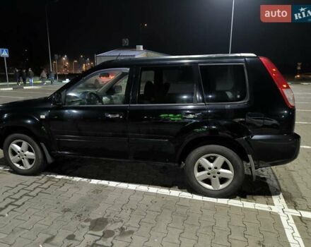 Черный Ниссан ИксТрейл, объемом двигателя 2.49 л и пробегом 128 тыс. км за 7500 $, фото 2 на Automoto.ua