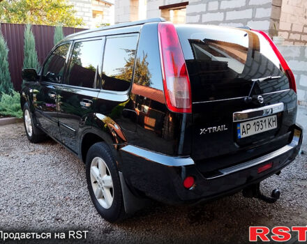 Черный Ниссан ИксТрейл, объемом двигателя 2 л и пробегом 200 тыс. км за 6200 $, фото 2 на Automoto.ua