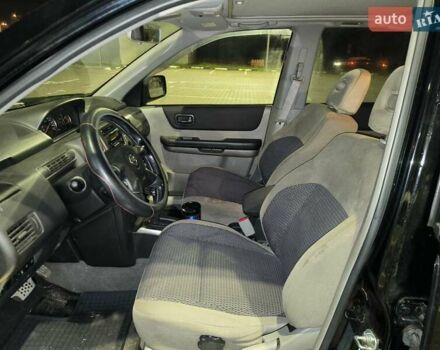 Черный Ниссан ИксТрейл, объемом двигателя 2.49 л и пробегом 128 тыс. км за 7500 $, фото 7 на Automoto.ua