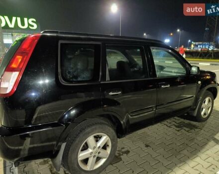 Черный Ниссан ИксТрейл, объемом двигателя 2.49 л и пробегом 128 тыс. км за 7500 $, фото 1 на Automoto.ua