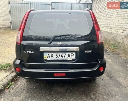 Черный Ниссан ИксТрейл, объемом двигателя 2 л и пробегом 150 тыс. км за 6500 $, фото 2 на Automoto.ua