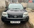 Черный Ниссан ИксТрейл, объемом двигателя 2 л и пробегом 150 тыс. км за 6500 $, фото 1 на Automoto.ua