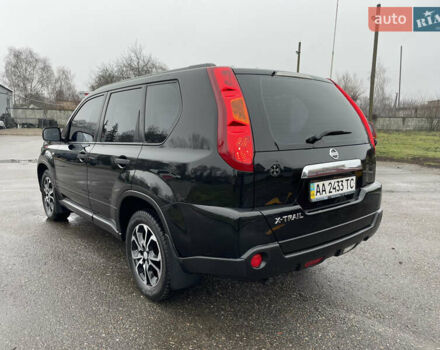 Черный Ниссан ИксТрейл, объемом двигателя 2 л и пробегом 210 тыс. км за 8750 $, фото 6 на Automoto.ua