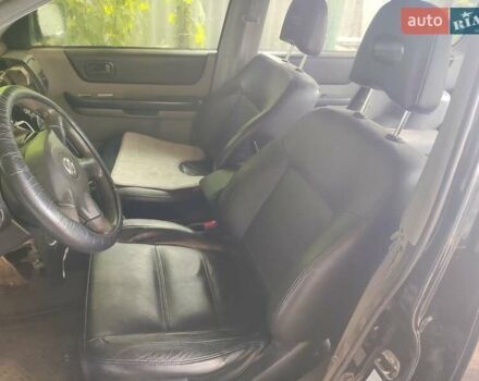 Черный Ниссан ИксТрейл, объемом двигателя 2.49 л и пробегом 195 тыс. км за 5200 $, фото 4 на Automoto.ua