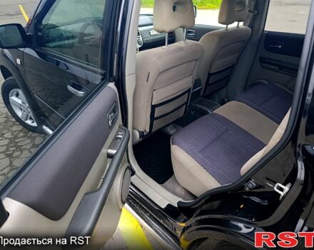 Черный Ниссан ИксТрейл, объемом двигателя 2.5 л и пробегом 170 тыс. км за 8600 $, фото 10 на Automoto.ua