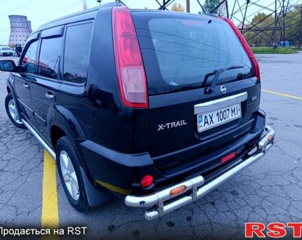 Черный Ниссан ИксТрейл, объемом двигателя 2.5 л и пробегом 170 тыс. км за 8600 $, фото 3 на Automoto.ua