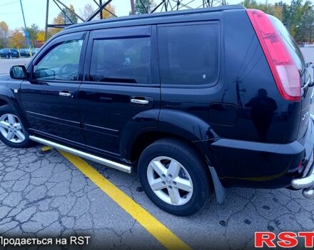 Черный Ниссан ИксТрейл, объемом двигателя 2.5 л и пробегом 170 тыс. км за 8600 $, фото 2 на Automoto.ua