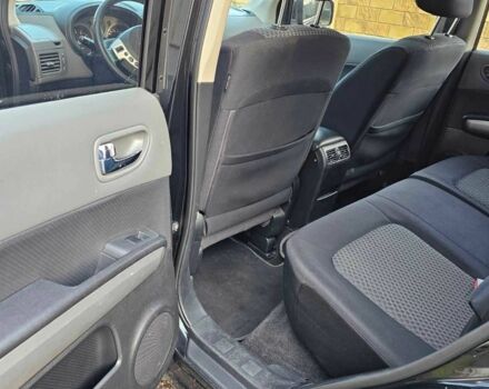 Черный Ниссан ИксТрейл, объемом двигателя 2 л и пробегом 230 тыс. км за 9000 $, фото 7 на Automoto.ua