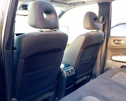 Черный Ниссан ИксТрейл, объемом двигателя 2 л и пробегом 238 тыс. км за 10500 $, фото 3 на Automoto.ua