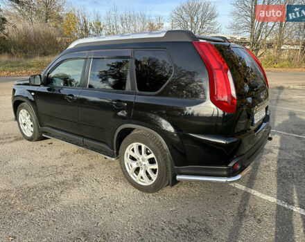 Чорний Ніссан ІксТрейл, об'ємом двигуна 2 л та пробігом 125 тис. км за 12999 $, фото 4 на Automoto.ua