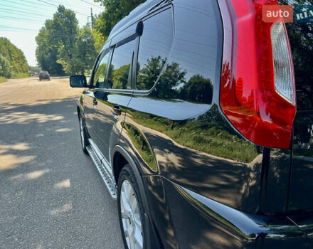 Черный Ниссан ИксТрейл, объемом двигателя 2 л и пробегом 125 тыс. км за 12300 $, фото 18 на Automoto.ua