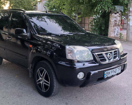 Черный Ниссан ИксТрейл, объемом двигателя 2 л и пробегом 300 тыс. км за 5500 $, фото 1 на Automoto.ua