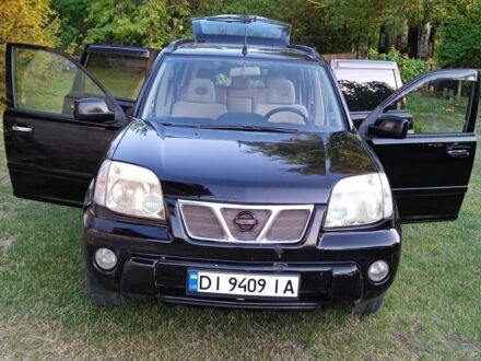 Чорний Ніссан ІксТрейл, об'ємом двигуна 2 л та пробігом 294 тис. км за 4999 $, фото 1 на Automoto.ua