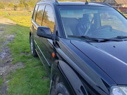 Черный Ниссан ИксТрейл, объемом двигателя 2 л и пробегом 276 тыс. км за 6000 $, фото 1 на Automoto.ua