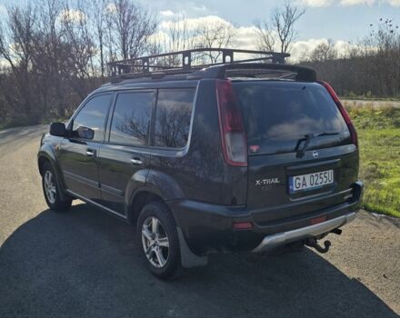 Черный Ниссан ИксТрейл, объемом двигателя 2 л и пробегом 365 тыс. км за 4023 $, фото 1 на Automoto.ua