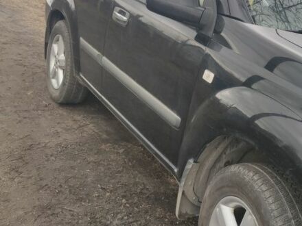 Черный Ниссан ИксТрейл, объемом двигателя 2 л и пробегом 270 тыс. км за 2700 $, фото 1 на Automoto.ua