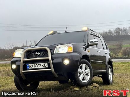 Черный Ниссан ИксТрейл, объемом двигателя 2 л и пробегом 250 тыс. км за 6000 $, фото 1 на Automoto.ua