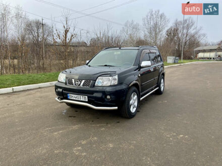 Черный Ниссан ИксТрейл, объемом двигателя 2.49 л и пробегом 300 тыс. км за 6200 $, фото 1 на Automoto.ua