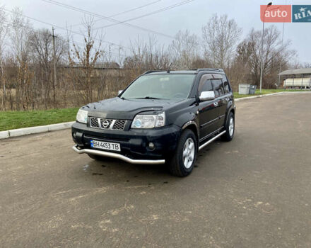 Черный Ниссан ИксТрейл, объемом двигателя 2.49 л и пробегом 300 тыс. км за 6200 $, фото 1 на Automoto.ua