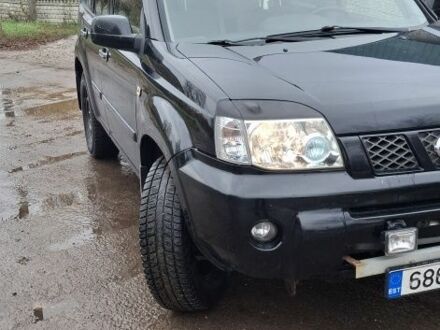 Черный Ниссан ИксТрейл, объемом двигателя 2 л и пробегом 260 тыс. км за 3800 $, фото 1 на Automoto.ua