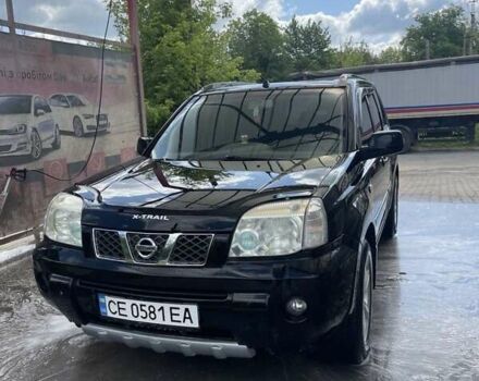 Черный Ниссан ИксТрейл, объемом двигателя 2.2 л и пробегом 300 тыс. км за 7000 $, фото 1 на Automoto.ua