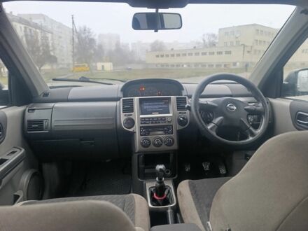 Черный Ниссан ИксТрейл, объемом двигателя 2 л и пробегом 123 тыс. км за 3100 $, фото 1 на Automoto.ua