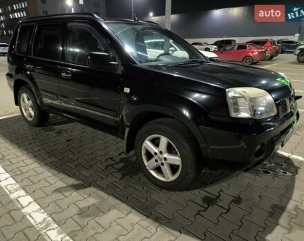 Черный Ниссан ИксТрейл, объемом двигателя 2.49 л и пробегом 128 тыс. км за 7500 $, фото 1 на Automoto.ua