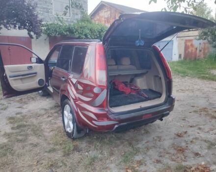 Красный Ниссан ИксТрейл, объемом двигателя 2 л и пробегом 342 тыс. км за 3999 $, фото 1 на Automoto.ua