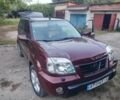 Красный Ниссан ИксТрейл, объемом двигателя 2 л и пробегом 342 тыс. км за 3999 $, фото 1 на Automoto.ua
