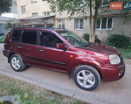 Красный Ниссан ИксТрейл, объемом двигателя 2 л и пробегом 342 тыс. км за 6000 $, фото 1 на Automoto.ua