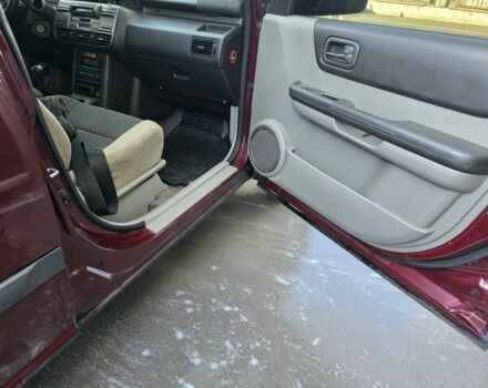 Червоний Ніссан ІксТрейл, об'ємом двигуна 2 л та пробігом 250 тис. км за 4499 $, фото 9 на Automoto.ua