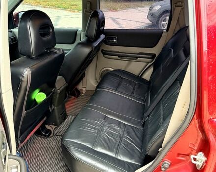 Красный Ниссан ИксТрейл, объемом двигателя 2.5 л и пробегом 270 тыс. км за 5600 $, фото 4 на Automoto.ua