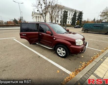 Красный Ниссан ИксТрейл, объемом двигателя 2.5 л и пробегом 270 тыс. км за 5600 $, фото 11 на Automoto.ua