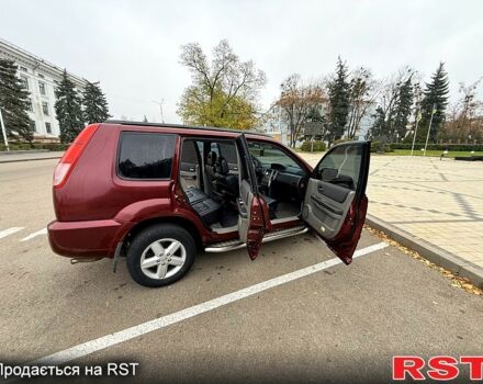 Красный Ниссан ИксТрейл, объемом двигателя 2.5 л и пробегом 270 тыс. км за 5600 $, фото 2 на Automoto.ua